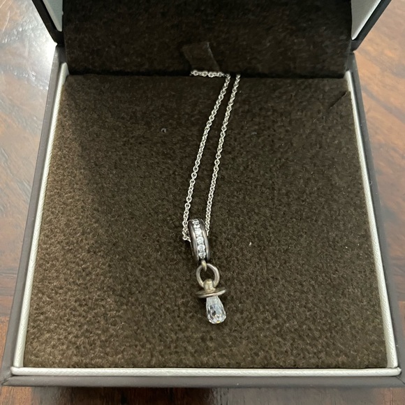 Silver necklace with a circle at end and pacifier at end of circle - Picture 2 of 6